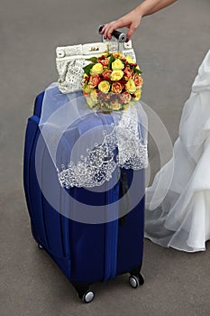 Bride with blue suitcase