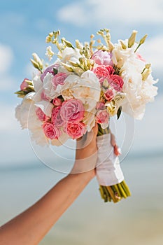 Bride bouquet on blue sky