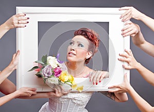 Bride with bouquet in frame