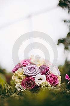 Bride bouquet in the grass