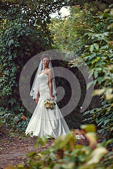 Bride with a bouquet in the hand