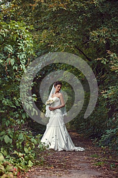 Bride with a bouquet in the hand