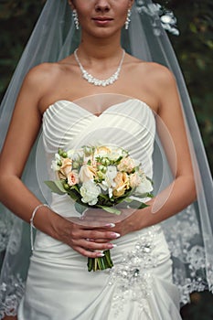 Bride with a bouquet in the hand