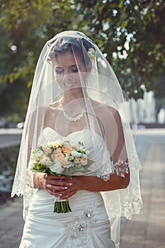 Bride with a bouquet in the hand