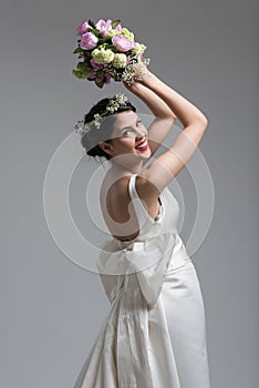 Bride with a bouquet isolated on white background