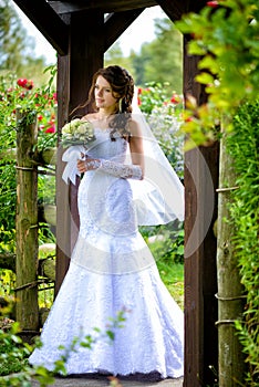 Bride with bouquet outdoors