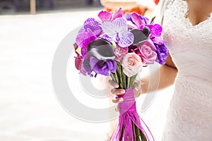 Bride bouquet with roses and orchids