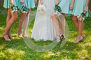 Bride and bridesmaids legs photo