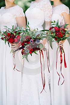 The bride and bridesmaids wedding bouquet with red