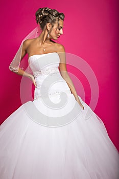 Bride on a bright pink background