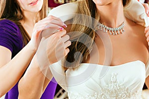 Bride at the clothes shop for wedding dresses