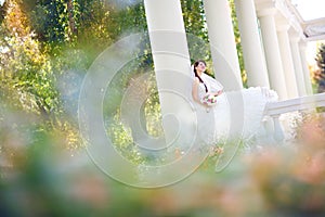 Bride in columns and leaves