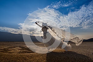 Bride  in the desert with blue sky