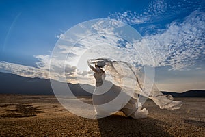 Bride  in the desert with blue sky
