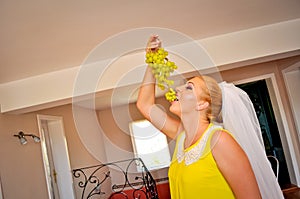 Bride eating grapes