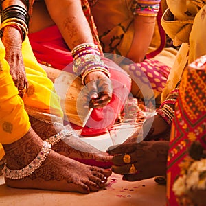 Bride feet coloring ceremony, a Hindu wedding ritual,