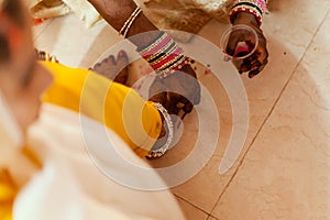 Bride feet coloring ceremony, a Hindu wedding ritual,