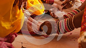 Bride feet coloring ceremony, a Hindu wedding ritual,