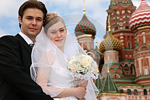 Bride, fiance and cathedral