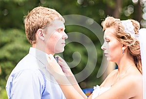 The Bride Fixing Bow Tie of groom