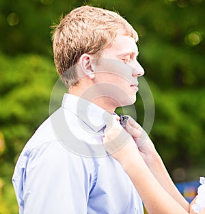 The Bride Fixing Groom's Bow Tie