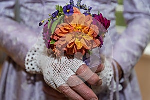 Bride with flower arrangement - close-up