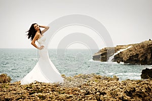 Bride in front of the sea