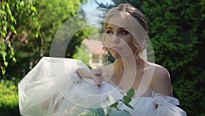 Bride funny adjusts her dress before meeting her groom