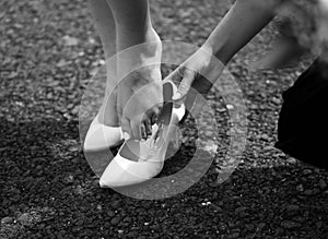 Bride gets her elegant shoes with a helping hand