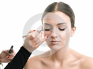 Bride getting eyeliner on eyelid