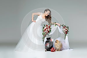 Bride girl with dog wedding couple under flower arch