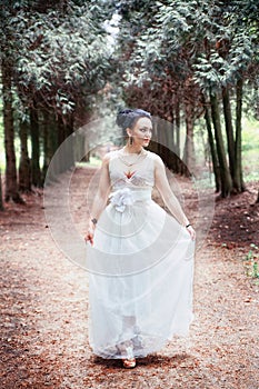 Bride, girl in white dress in the park