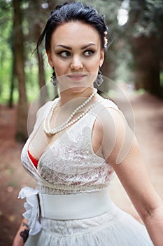 Bride, girl in white dress in the park