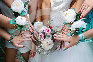 Bride and girlfriends with ribbons
