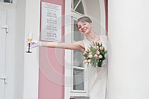 Bride with glass of wine