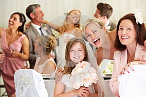 Bride With Grandmother And Bridesmaid At Wedding Reception