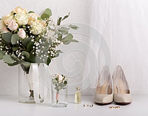 Bride groom accessories with bouquet and high heel shoes