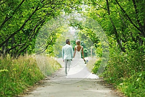 The bride and groom in the alley