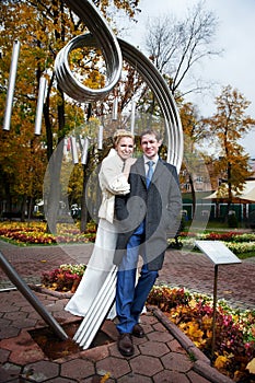 Bride and groom about art ironwork photo