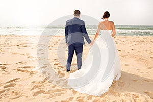 bride and groom on the beach Just married couple