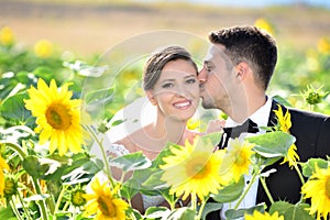 Bride and groom in a beautiful light holding hug