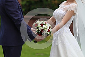 Bride and groom with bouquet photo