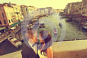 Bride and groom on a bridge in Venice