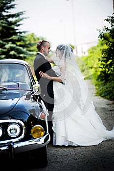 Bride and groom in car