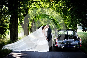 Bride and groom in car