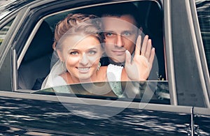 Bride and groom in the car