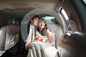 Bride and groom in a car