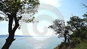 The bride and groom on a cliff