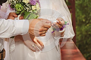 bride and groom close-up hands and lock with keys