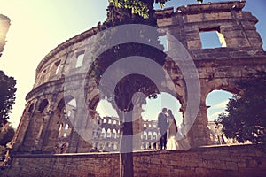 Bride and groom at Colosseum, Rome